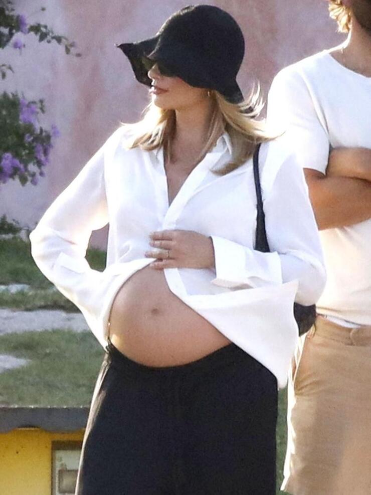 Margot Robbie Proudly Displays Baby Bump During Sardinia Holiday