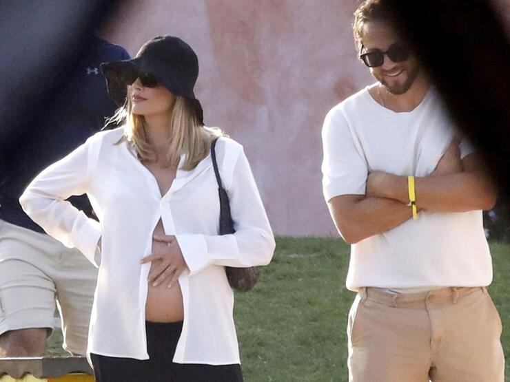 Margot Robbie Proudly Displays Baby Bump During Sardinia Holiday