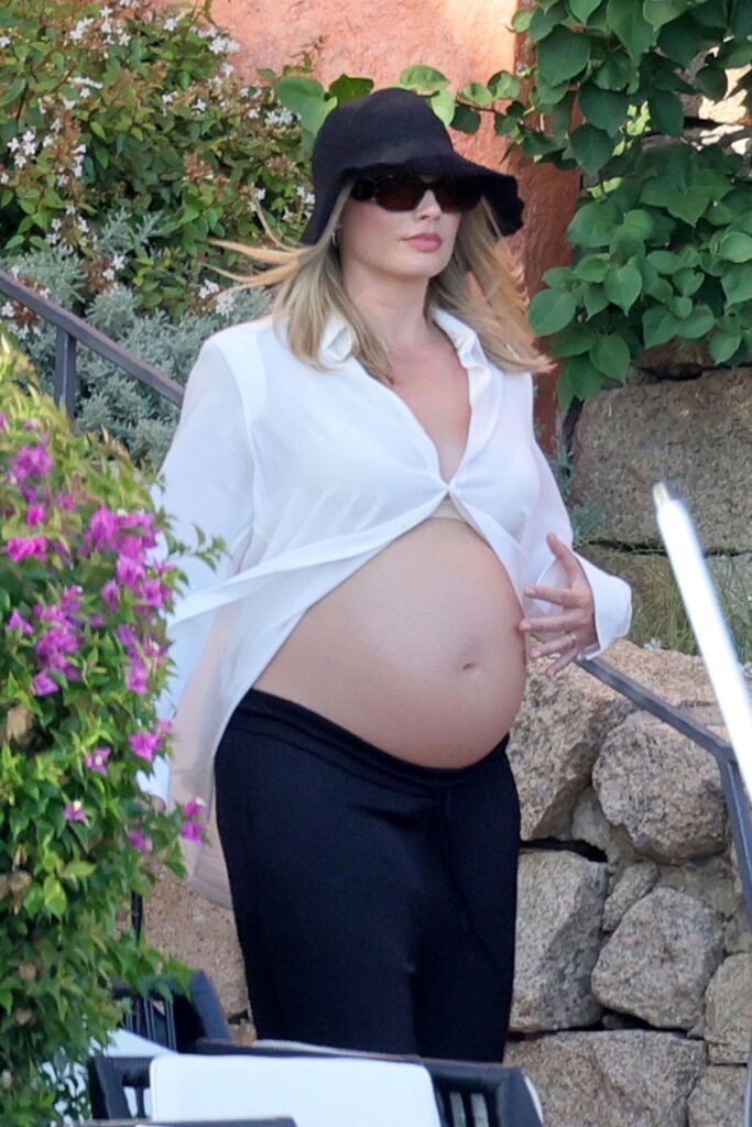 Margot Robbie Radiates Joy in Sardinia Amid Exciting Family News and Baby Bump Reveal