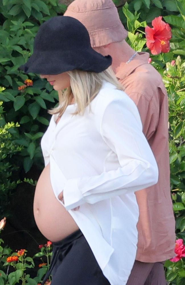 Margot Robbie Proudly Displays Baby Bump During Sardinia Holiday