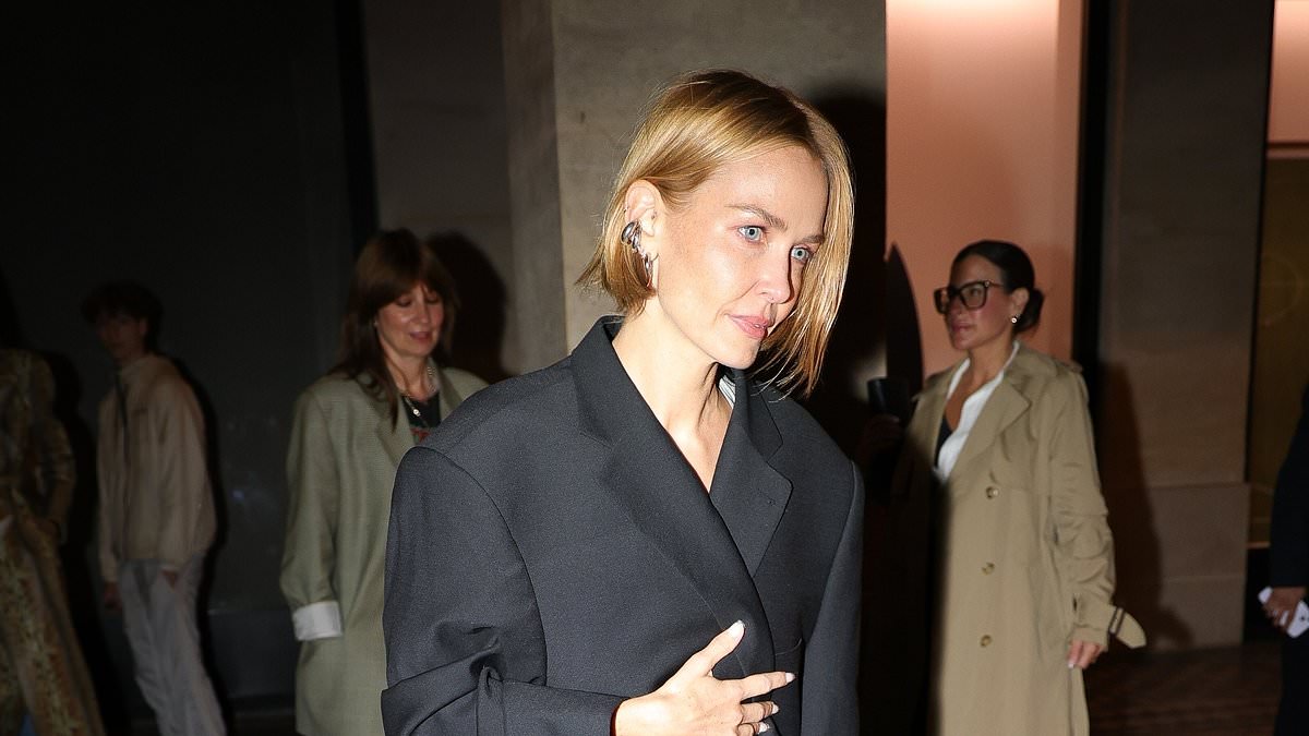 Lara Worthington Dazzles in Oversized Black Coat at Vetements Fashion Event in Paris