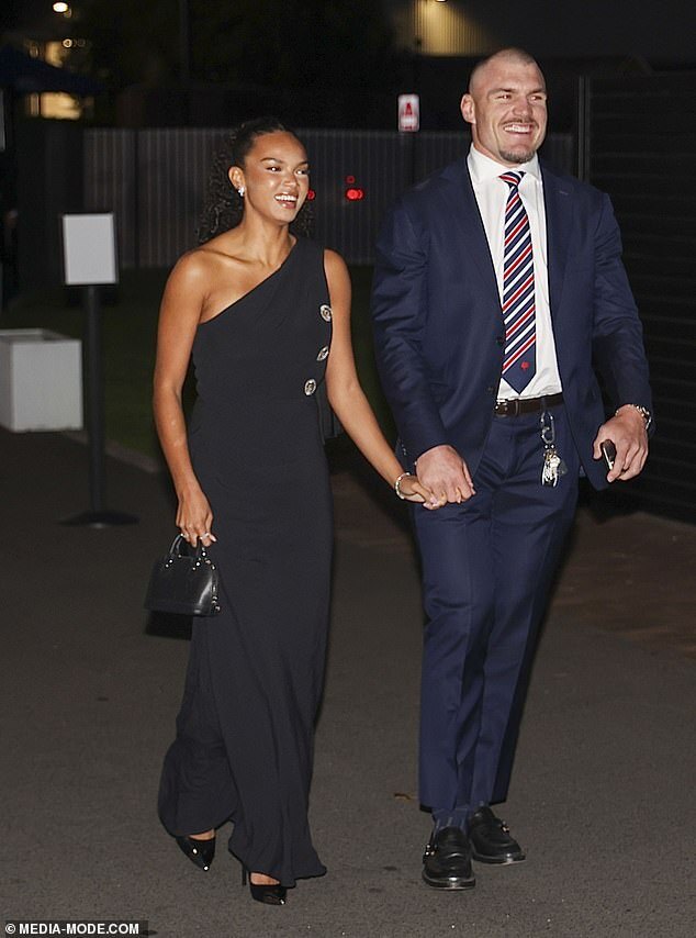 Glamorous Night for Sydney Roosters: Players Shine in Navy Suits, Wives Dazzle in Stunning Gowns