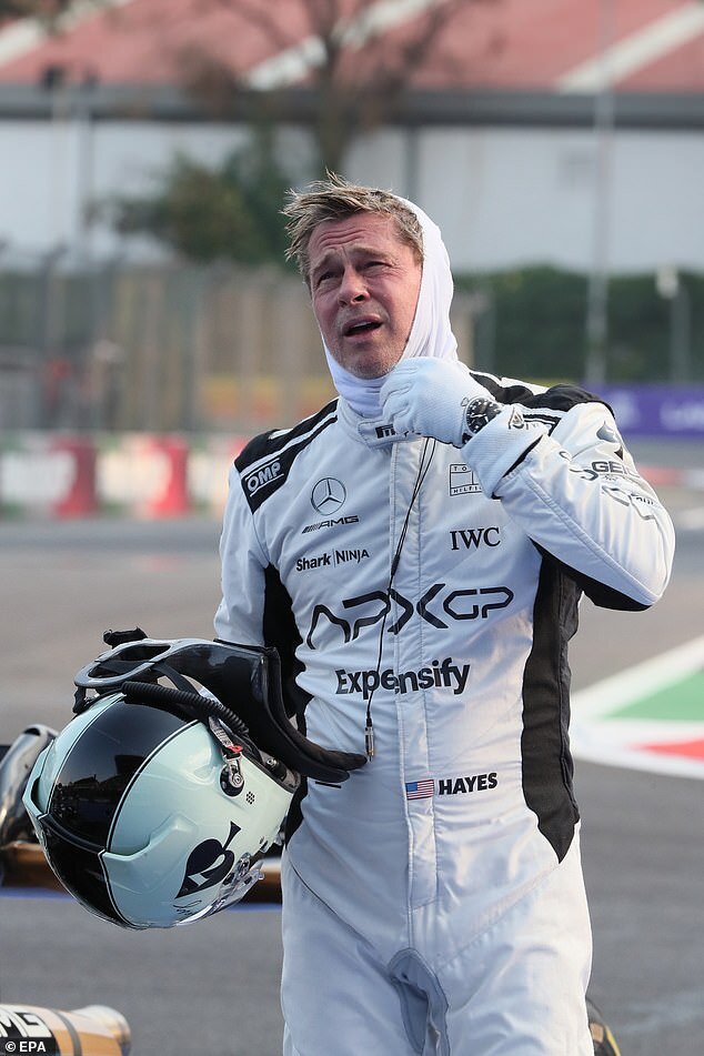 Brad Pitt Reacts to Unexpected Neck Grab and Kiss from Fan at Mexican Grand Prix Event