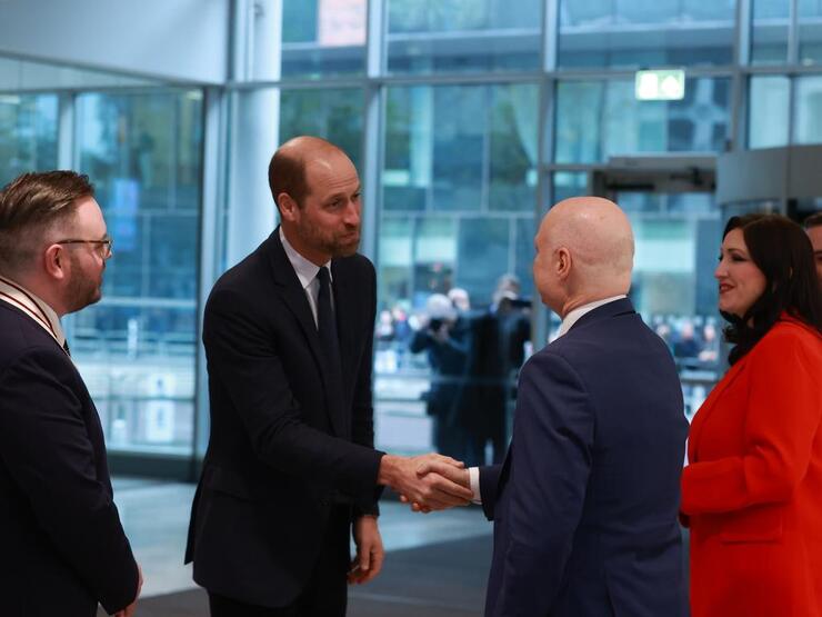 Prince William Explores Ulster University, Shares Humor on Stationary Motorcycle