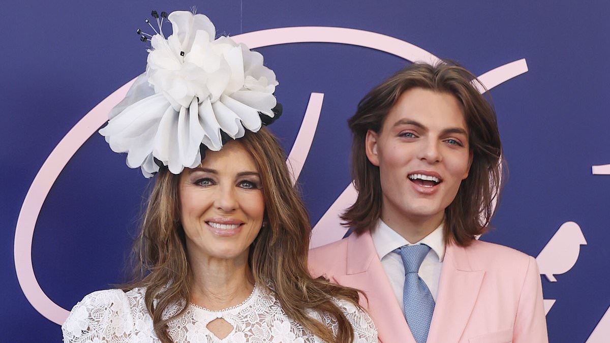 Elizabeth Hurley Shines in White Lace Gown with Lookalike Son Damian at 2024 Crown Oaks Day